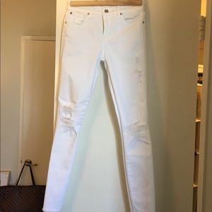 7 For All Mankind ripped jeans in white.